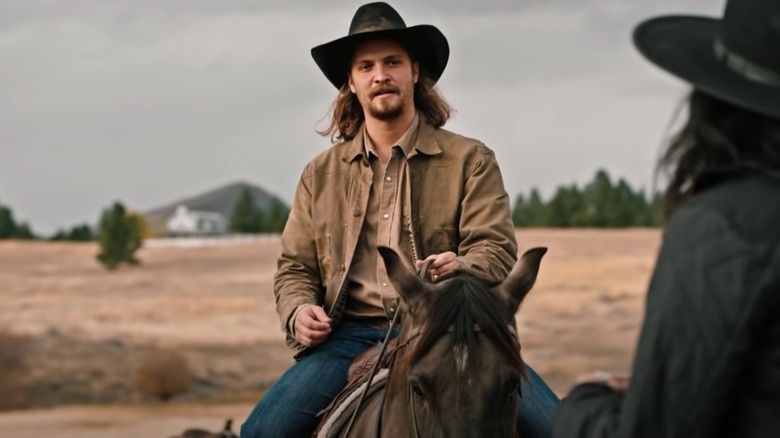 Luke Grimes riding a horse