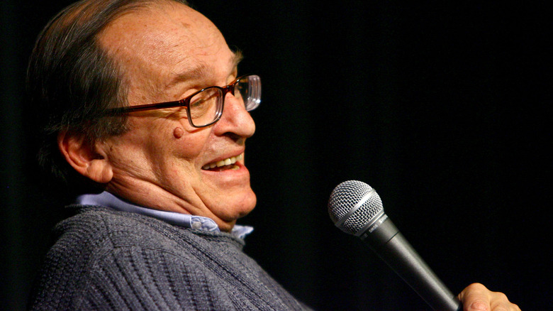 Sidney Lumet holding microphone