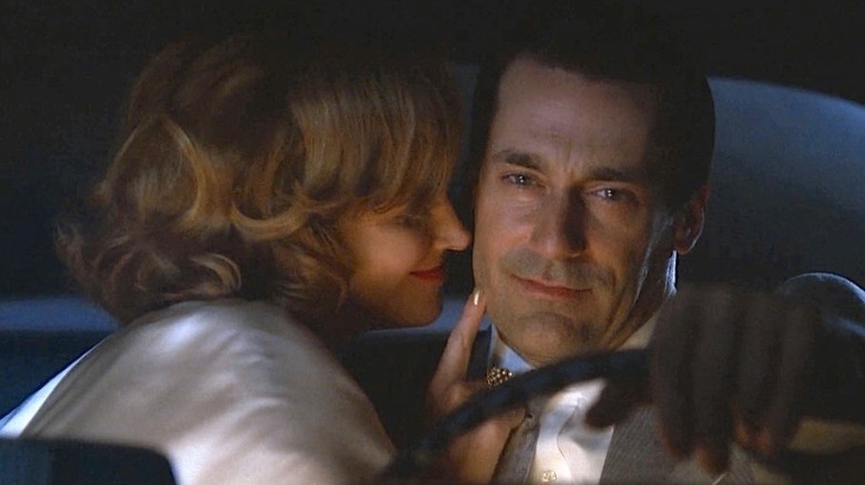 Bobbie Barrett kissing driving Don Draper