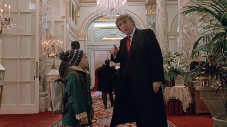 Trump pointing down hallway