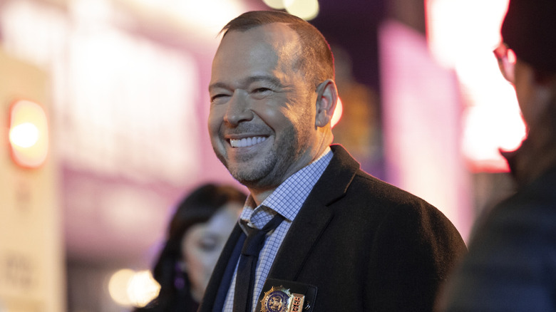 Donnie Wahlberg smiling on-set