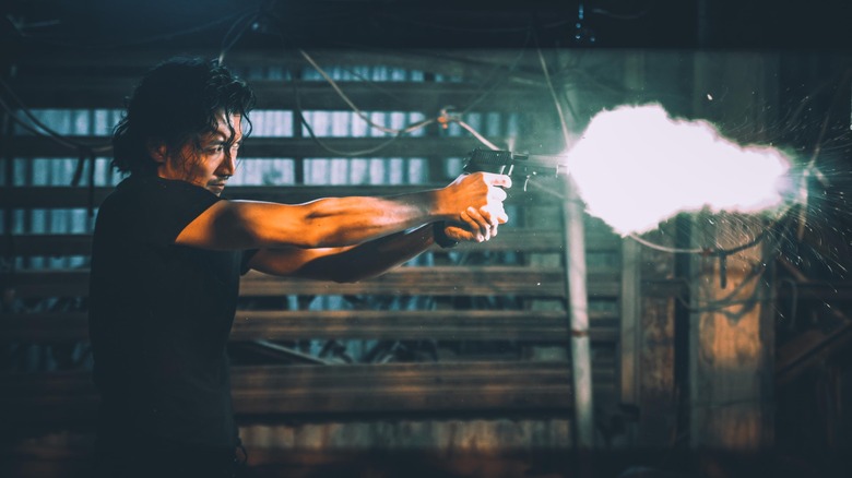 Nicholas Tse shooting gun