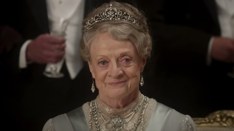 Maggie Smith as Lady Violet smiling in Downton Abbey movie