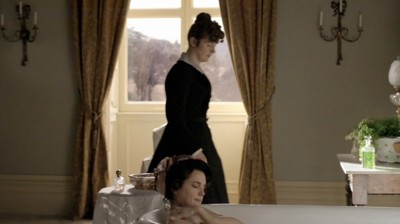 Cora bathing in front of O'Brien