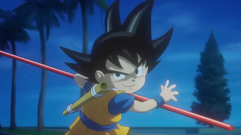 Goku wields a staff