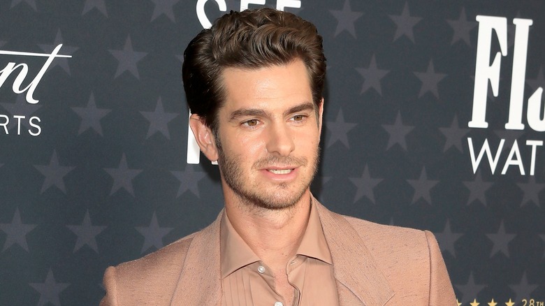 Andrew Garfield smizing for the press