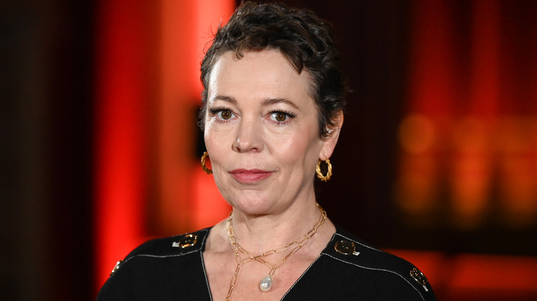 Olivia Colman standing in theater