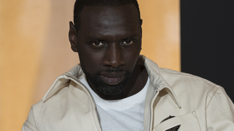 Omar Sy stares