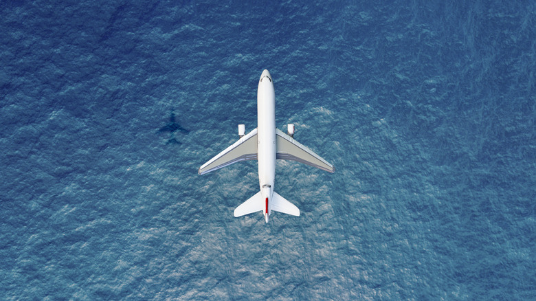 Airplane flying over the sea