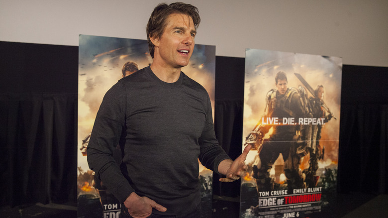 Tom Cruise wearing dark shirt