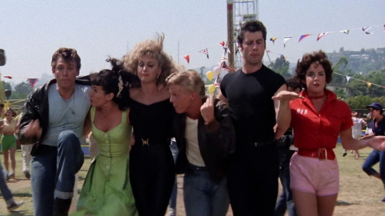 Grease gang strutting through carnival