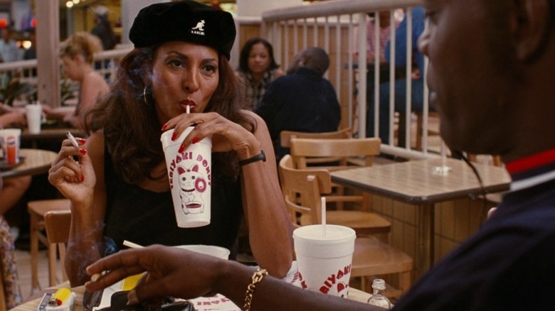 Pam Grier smoking and drinking soda