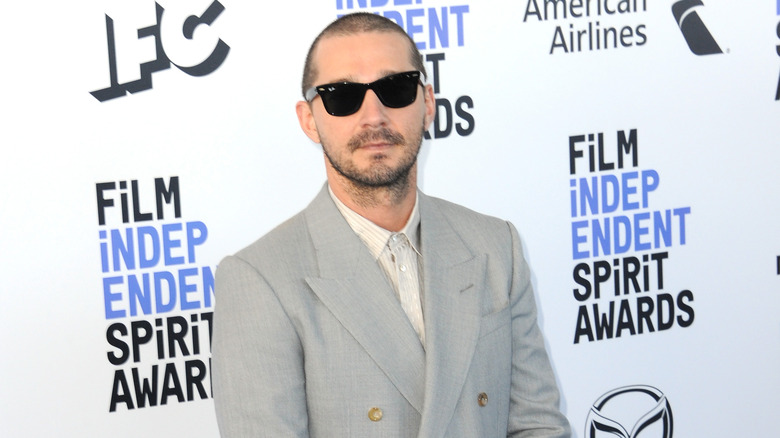 Shia LaBeouf posing in sunglasses