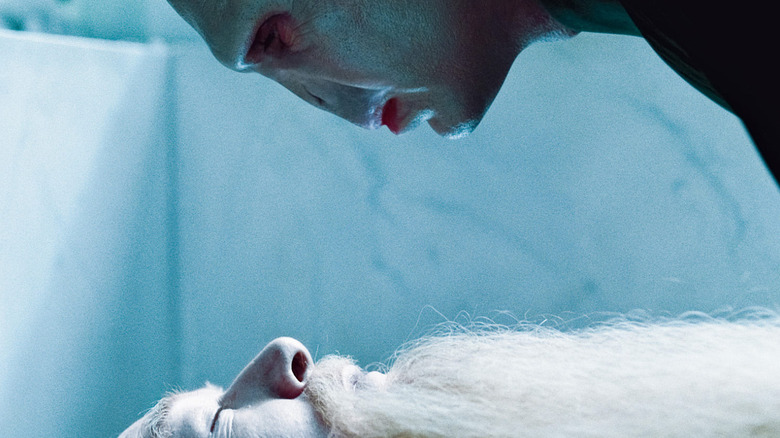 Lord Voldemort looking over Dumbledore's body at his grave in Harry Potter and the Half-Blood Prince.