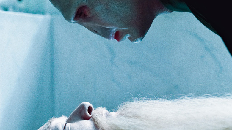 Voldemort looks over a dead Dumbledore in Harry Potter