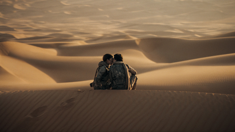 Chani kissing Paul on a dune