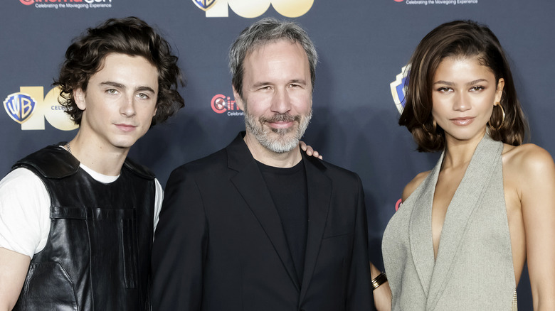 Timothee Chalamet, Denis Villeneuve, and Zendaya smiling