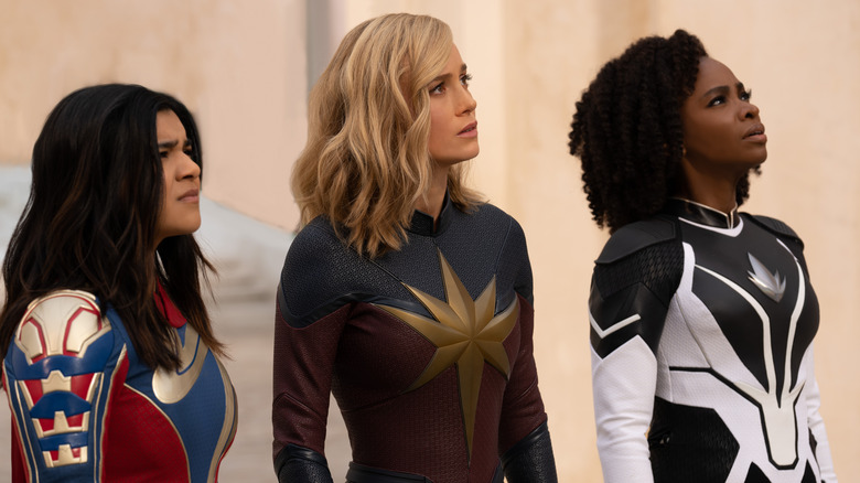 Ms. Marvel, Captain Marvel, and Monica Rambeau looking up