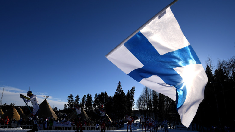 Finnish flag and skiers