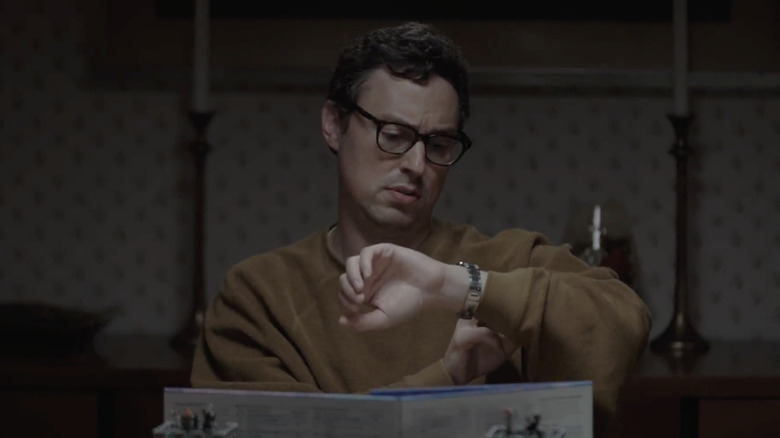 John Francis Daley checking his watch