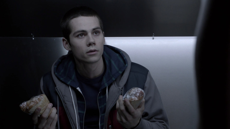 Stiles holding sandwiches