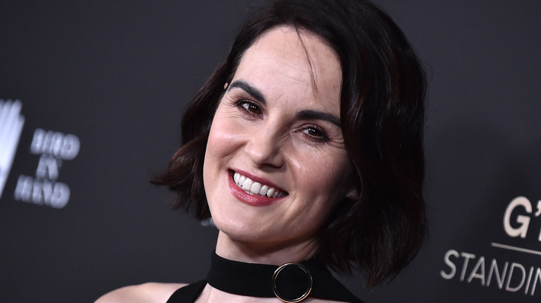 Michelle Dockery smiles on the red carpet