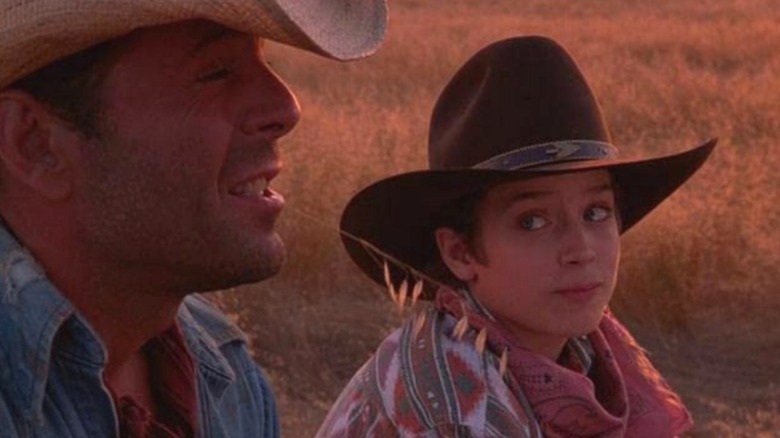 Bruce Willis and Elijah Wood wearing cowboy hats