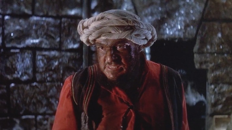 John Rhys-Davies in a turban scowling