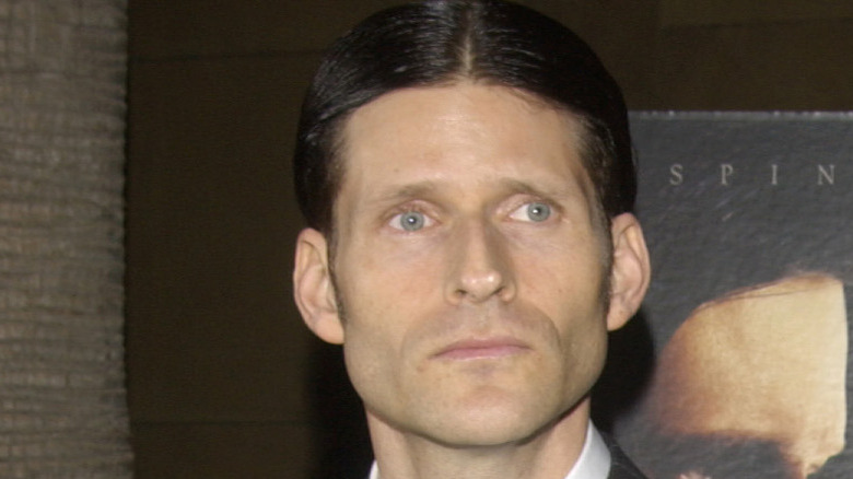 Crispin Glover has slicked-back hair