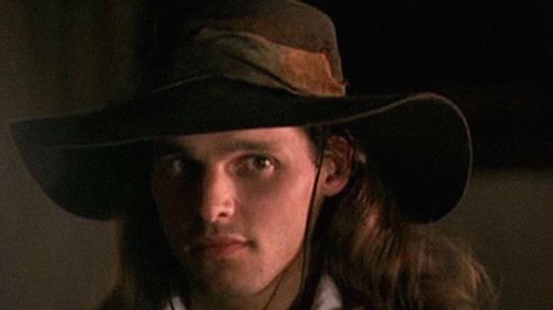 Justin Chambers wears an oversized hat