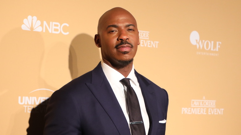 Mehcad Brooks poses in a suit 