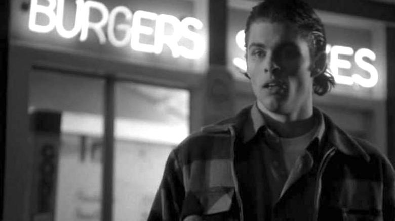 James Marsden in front of a burger sign