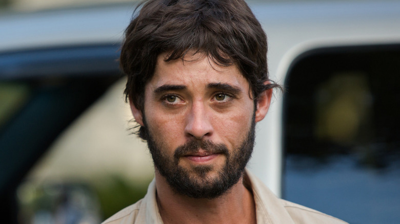 Ryan Bingham looks left