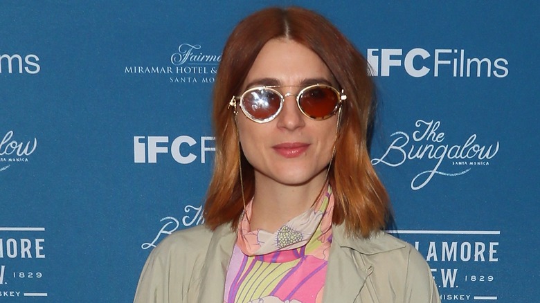 Aya Cash wearing tinted sunglasses