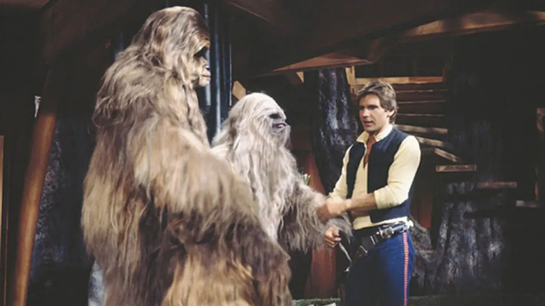 Han solo greets two wookies