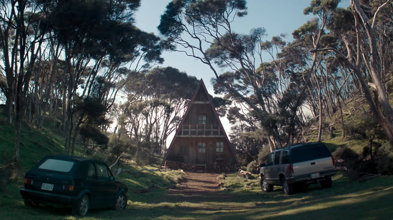 A shot of the triangular cabin in the woods