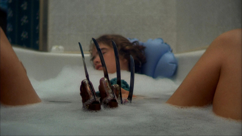 Freddy's arm rises from the bathtub 