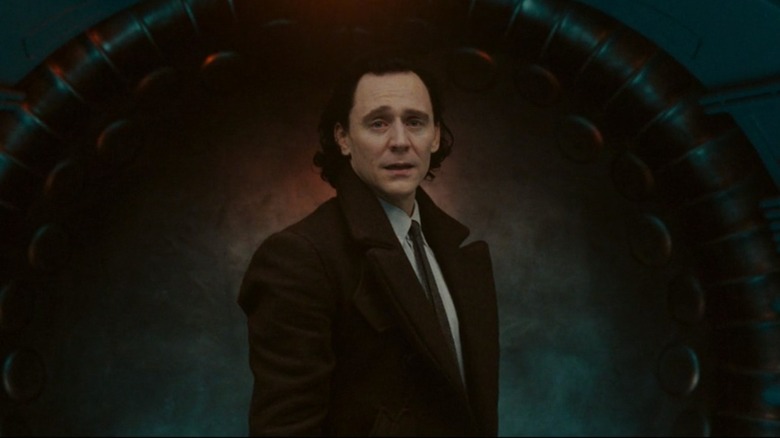 Loki standing at blast doors