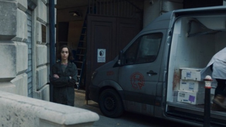 G'iah standing in front of butcher's truck