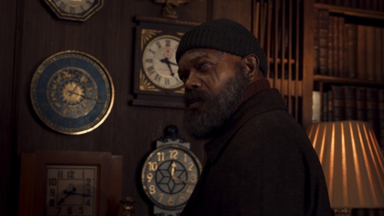 Nick Fury examining clocks