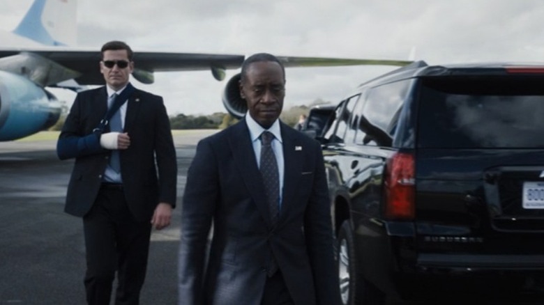 Agent and Rhodey outside armored vehicle