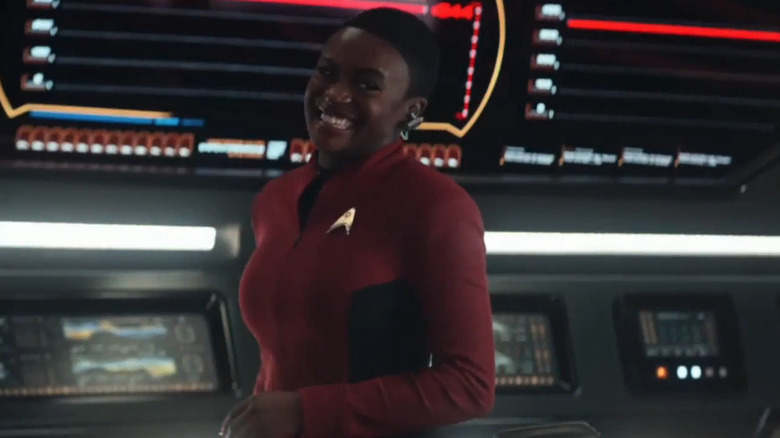 Uhura smiles on the bridge