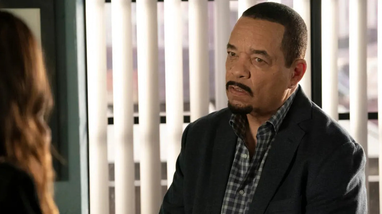 Detective Tutuola sits in office