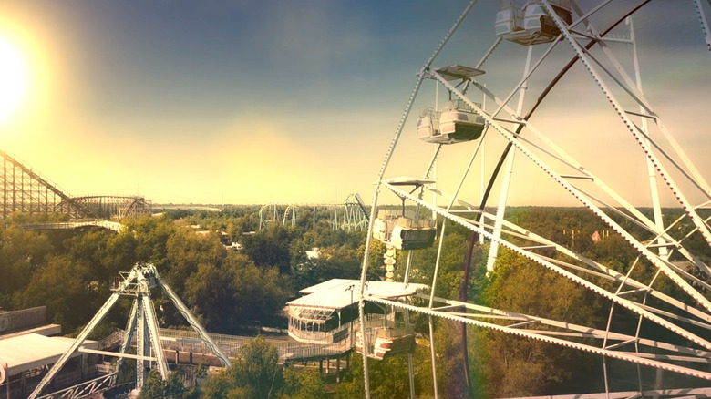 The sun setting on Thrills and Spills amusement park