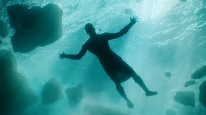 Black Adam floating in ocean