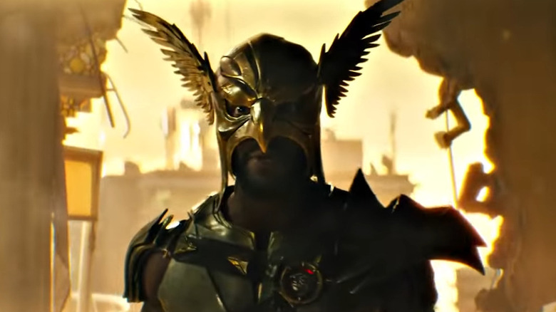 Hawkman standing in damaged building