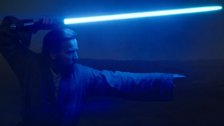 Obi-Wan posing with his lightsaber