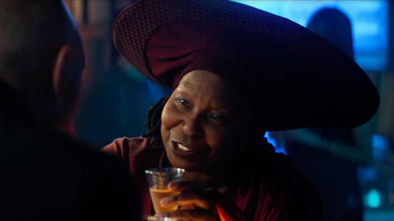 Guinan behind the bar