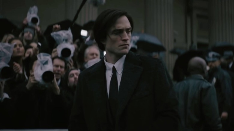 Bruce Wayne attending a funeral