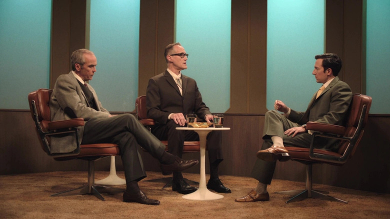 Three men having a roundtable discussion